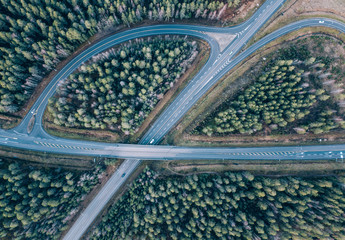 beautiful Aerial view of highway and overpass with green woods in Finland near Helsinki