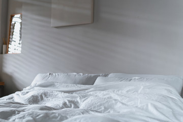 quilt bed white pillows on white bed in bedroom