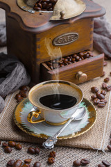 Black coffee on an old background in a cup