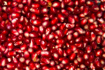Fresh pommegranate grains backdrop