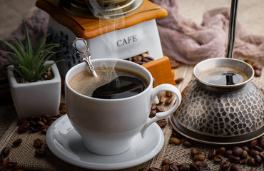 Black coffee on an old background in a cup