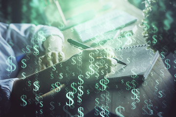 Financial forex charts displayed on woman's hand taking notes background. Concept of research. Double exposure