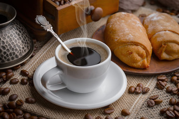 Black coffee on an old background in a cup