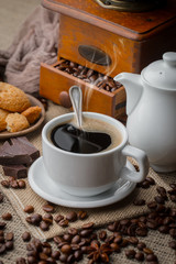 Black coffee on an old background in a cup