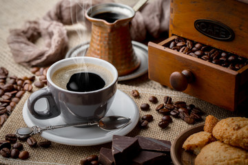 Black coffee on an old background in a cup