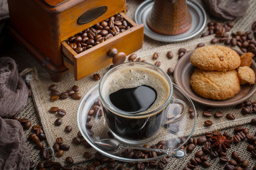 Black coffee on an old background in a cup