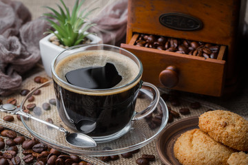 Black coffee on an old background in a cup