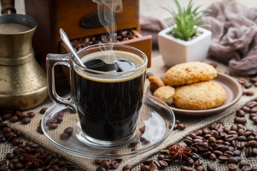 Black coffee on an old background in a cup