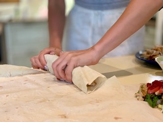 Women cooks shawarma