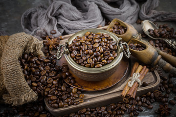 Coffee grains on a table with accessories for coffee