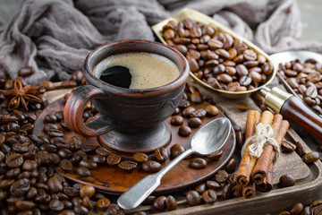Coffee in a cup and saucer on an old background.