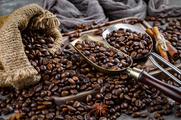 Coffee grains on a table with accessories for coffee
