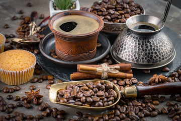 Coffee in a cup and saucer on an old background.