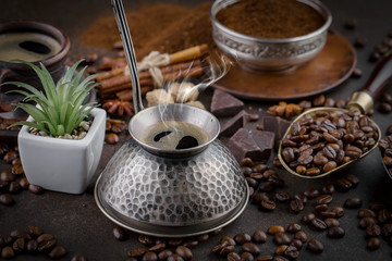 Coffee in a cup and saucer on an old background.