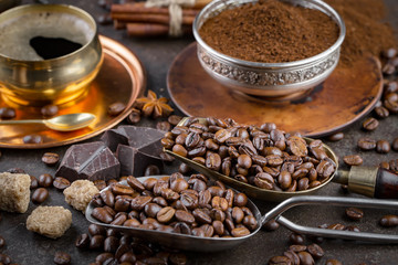 Coffee grains on a table with accessories for coffee