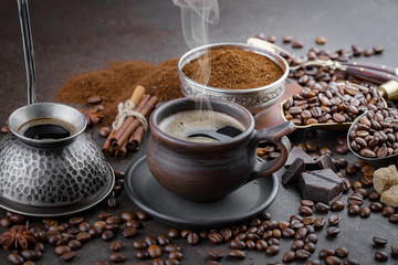 Coffee in a cup and saucer on an old background.