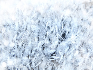 winter background with snowflakes crystals patterns and snow on frozen grass