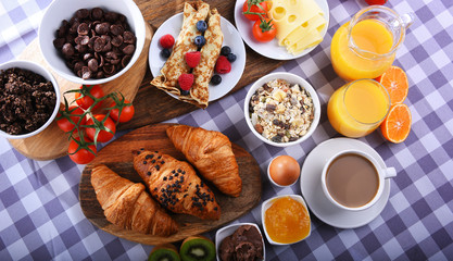 Breakfast served with coffee, juice, croissants and fruits