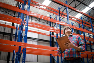 Naklejka premium Asian Engineer man working in building factory