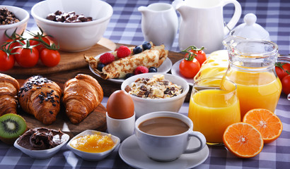 Breakfast served with coffee, juice, croissants and fruits