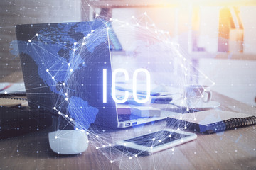 Multi exposure of blockchain theme hologram and table with computer background. Concept of bitcoin crypto currency.