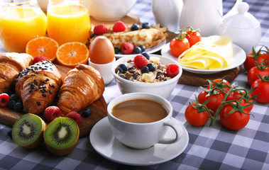 Breakfast served with coffee, juice, croissants and fruits