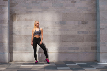 Fototapeta na wymiar Attractive woman in sportswear training outdoor. Sport, jogging, healthy and active lifestyle.