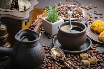 Coffee beans are roasted in a pan with smoke.