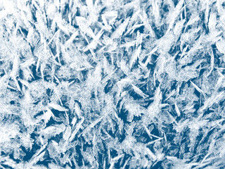 winter background with snowflakes crystals patterns and snow on frozen grass