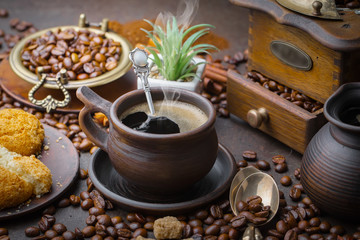 Black coffee on an old background in a cup