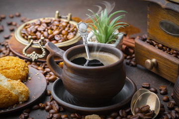 Obraz na płótnie Canvas Black coffee on an old background in a cup