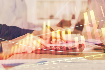 Financial trading graph multi exposure with man desktop background.