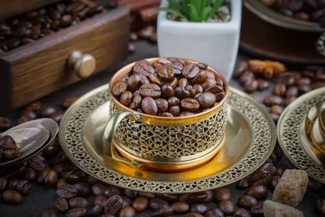 Coffee grains on a table with accessories for coffee