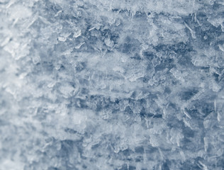 winter background with snowflakes crystals patterns and snow on frozen grass