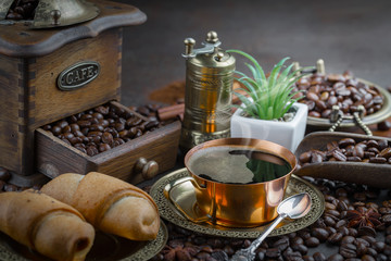 Black coffee on an old background in a cup