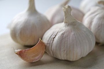 Garlic Cloves and Bulb on wooden table, Close-up