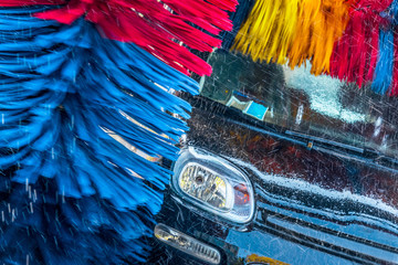 Car going through an automated car wash machine