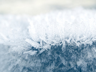 winter background with snowflakes crystals patterns and snow on frozen grass