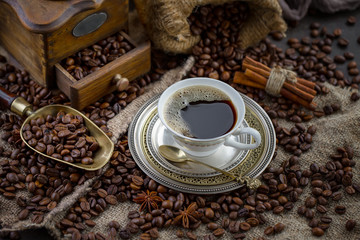 Black coffee on an old background in a cup