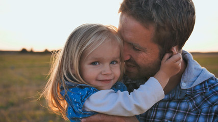 Little daughter plays with father s face and tortures him funny.