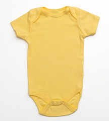 Baby's bodysuit isolated on white background/ Close-up/ Top-view/ Baby clothes 