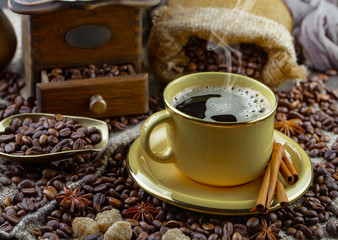 Coffee in a cup and saucer on an old background.