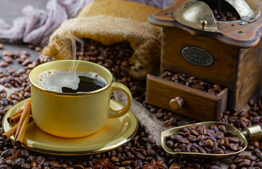Coffee in a cup and saucer on an old background.