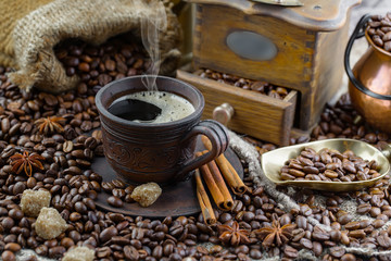 Coffee in a cup and saucer on an old background.