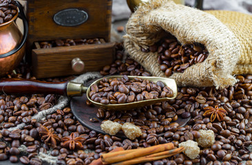 Coffee grains on a table with accessories for coffee