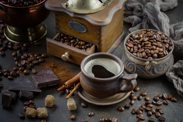 Black coffee on an old background in a cup