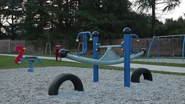 absence of children in the park, panning shot of empty playground