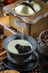 Black coffee on an old background in a cup