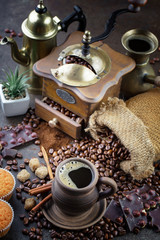 Coffee grains on a table with accessories for coffee