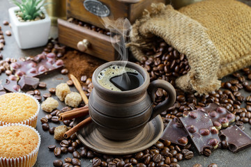 Black coffee on an old background in a cup